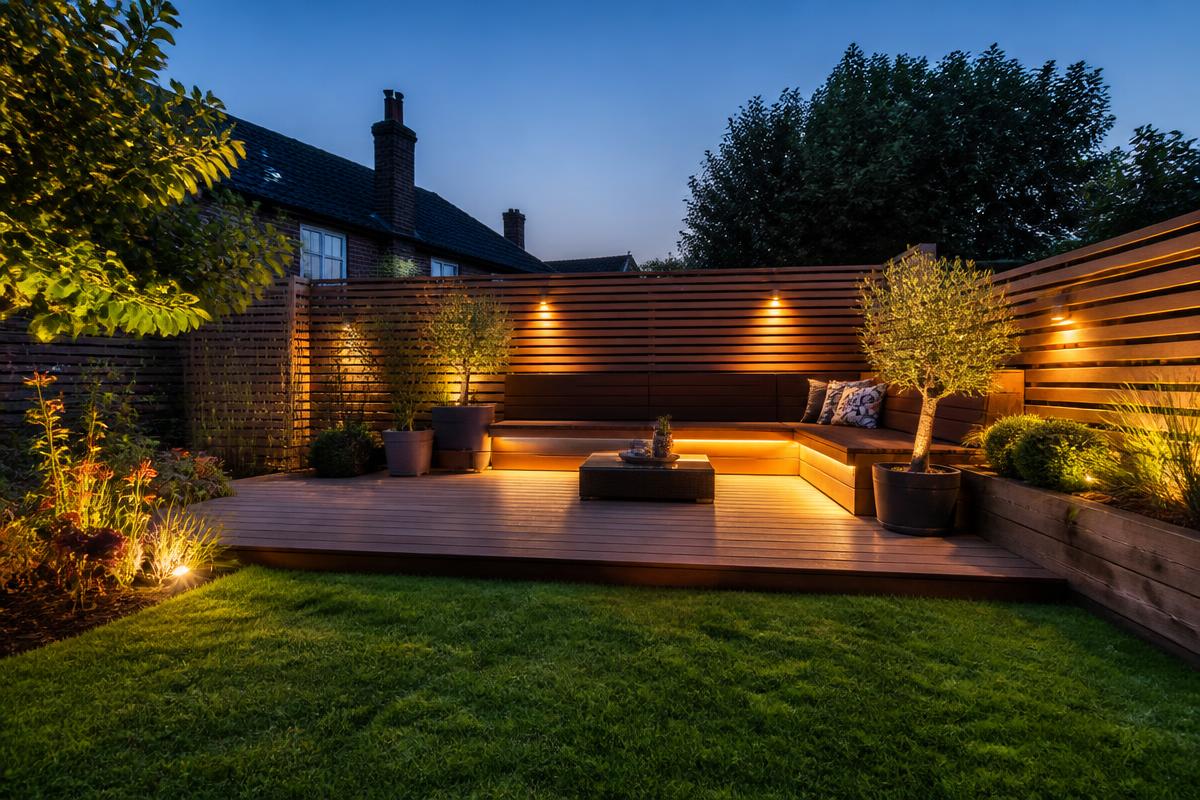 Timber decking with built-in seating, slat fencing and garden lighting